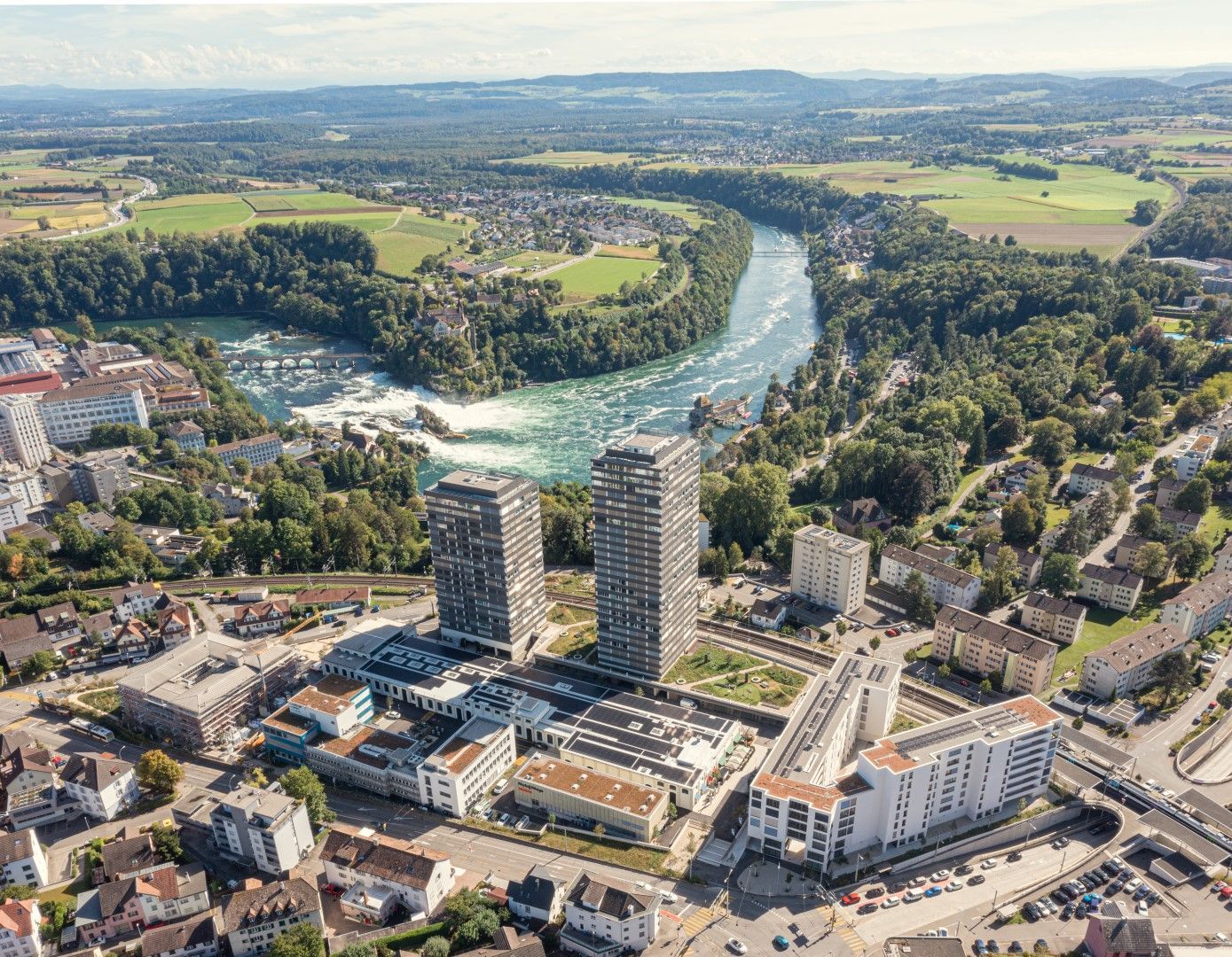 An aerial view of a city with a river running through it.